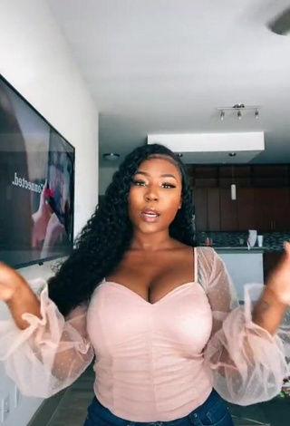 Erotic Airionna Lynch Shows Cleavage in Pink Top