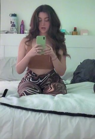 1. Sexy Simone Shows Cleavage in Brown Crop Top