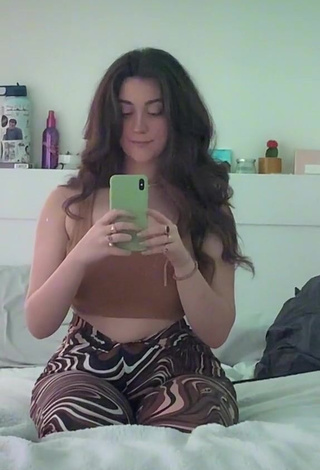 2. Sexy Simone Shows Cleavage in Brown Crop Top