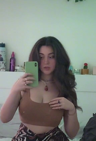 3. Sexy Simone Shows Cleavage in Brown Crop Top