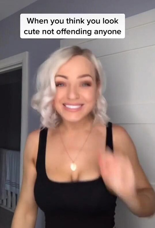 Cute Maria Shows Cleavage in Black Crop Top