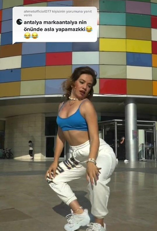 Erotic Melodi Özerdem in Blue Sport Bra in a Street