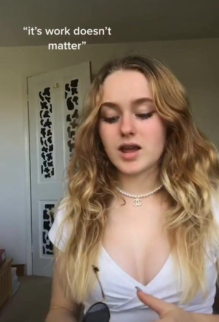 Irresistible Grace Shows Cleavage in White Crop Top