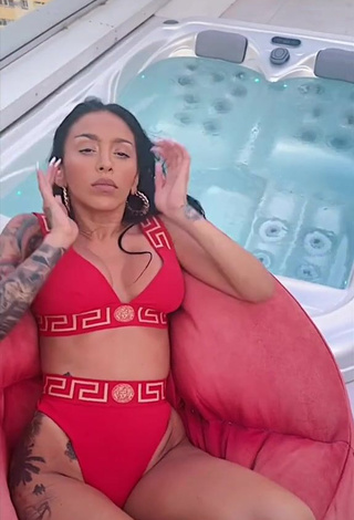 1. Irresistible Ruby Shows Cleavage in Red Bikini