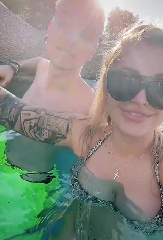 Erotic Timii Shows Cleavage in Snake Print Bikini at the Pool