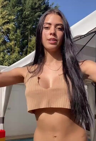 1. Captivating Ydrissia️ Shows Cleavage in Beige Crop Top