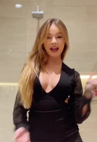 1. Captivating bela Shows Cleavage in Black Dress (Side Boob)