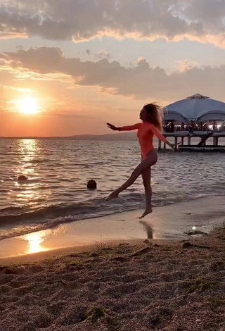 2. Erotic Diana Belitskay in Orange Bodysuit at the Beach