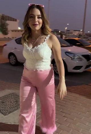 Erotic Bessan Ismail Shows Cleavage in White Top in a Street