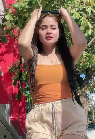 1. Hottie Christian Mae Shows Cleavage in Orange Top