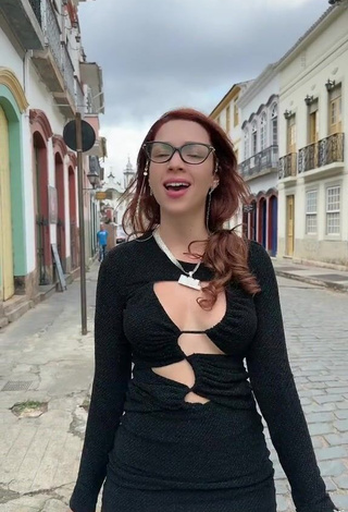 Erotic Cibelly Ferreira Shows Cleavage in Black Dress in a Street (Side Boob)