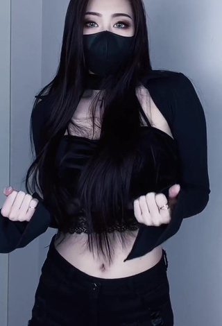 Lovely Han Qui Shows Cleavage in Black Crop Top