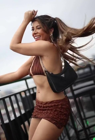 Sensual Ingrid Ohara Shows Cleavage in Brown Crop Top