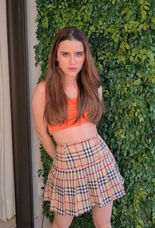 1. Hot Letícia Pedro Shows Cleavage in Orange Crop Top