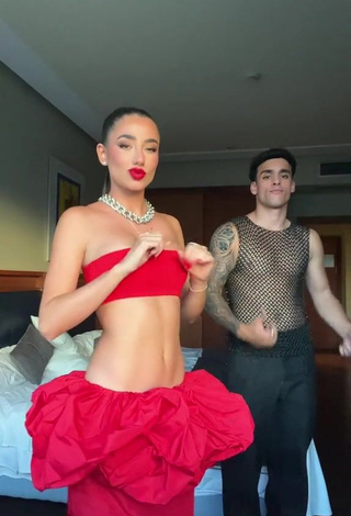 3. Hot Lola Moreno Marco Shows Cleavage in Red Tube Top