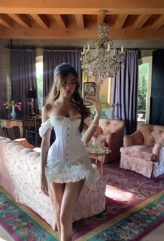 1. Irresistible Madison Beer Shows Cleavage in White Dress