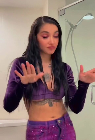 Dazzling Maria Becerra Shows Cleavage in Inviting Purple Crop Top (Underboob)