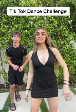 1. Hot McKenzi Brooke Shows Cleavage in Black Dress