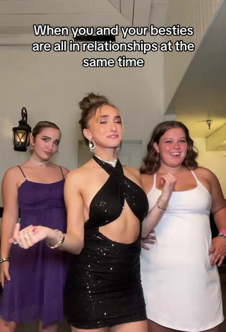 Erotic McKenzi Brooke Shows Cleavage in Black Dress