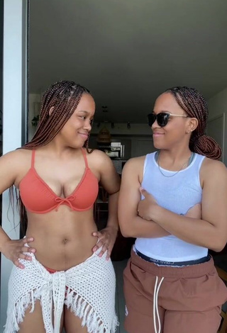 3. Captivating Treona & Trechelle Andino Shows Cleavage in Orange Bikini Top