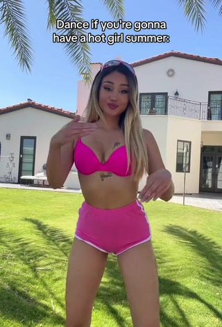 Erotic Star Abelar Shows Cleavage in Pink Bikini Top