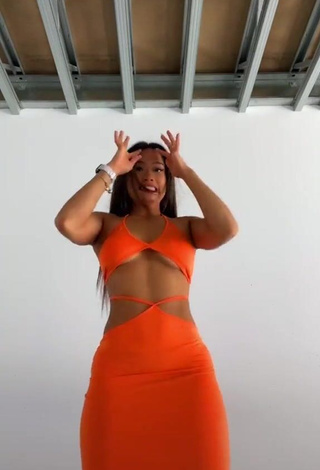 1. Hot Sarah Magusara in Orange Dress