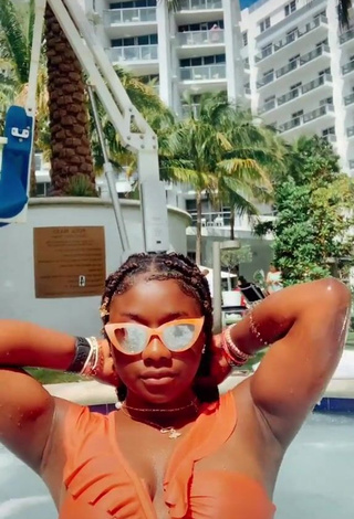 Erotic Aba Asante in Orange Bikini at the Pool