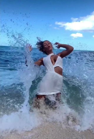 Erotic Jena Shows Cleavage in White Dress at the Beach