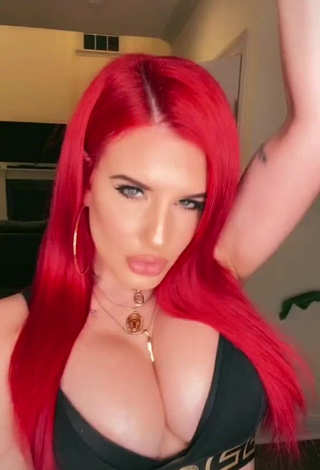 3. Cute Justina Valentine Shows Cleavage in Black Crop Top