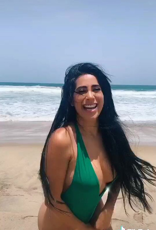 Erotic Kim Shantal Shows Cleavage in Green Swimsuit at the Beach