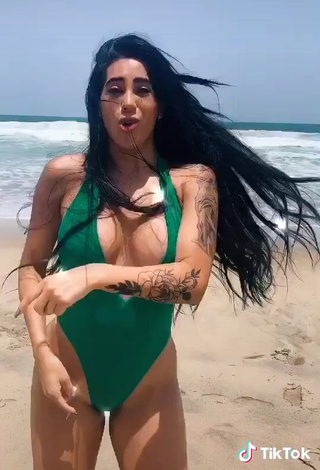 3. Erotic Kim Shantal Shows Cleavage in Green Swimsuit at the Beach