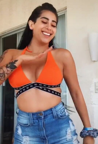 Sexy Kim Shantal Shows Cleavage in Orange Crop Top