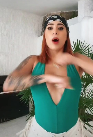 Erotic Kim Shantal Shows Cleavage in Green Top