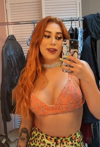 Alluring Kim Shantal Shows Cleavage in Erotic Orange Crop Top