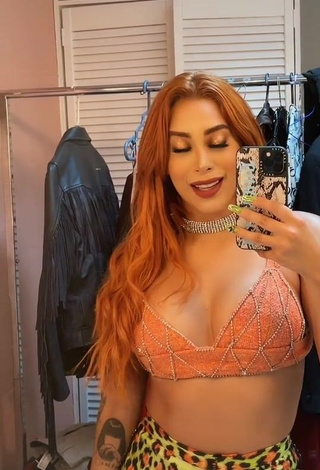 3. Alluring Kim Shantal Shows Cleavage in Erotic Orange Crop Top