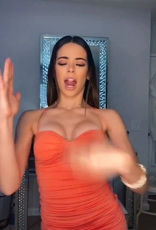 3. Erotic Lauren Kettering Shows Cleavage in Orange Dress and Bouncing Boobs