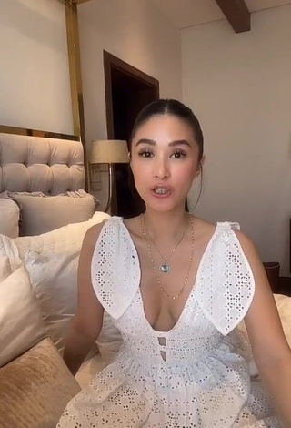 1. Erotic Heart Evangelista Shows Cleavage in White Dress