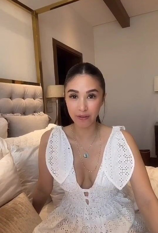 3. Erotic Heart Evangelista Shows Cleavage in White Dress