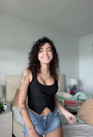 Beautiful Malu Trevejo Shows Cleavage in Sexy Black Top