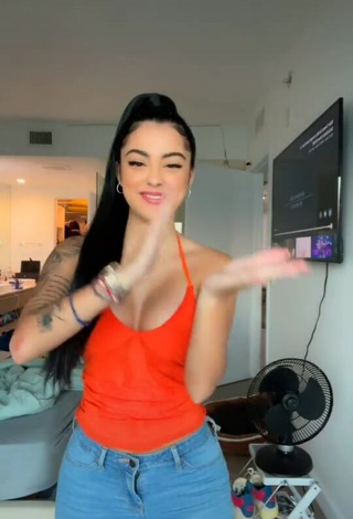 1. Sweetie Malu Trevejo Shows Cleavage in Orange Top