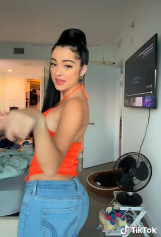 Sweetie Malu Trevejo Shows Cleavage in Orange Top