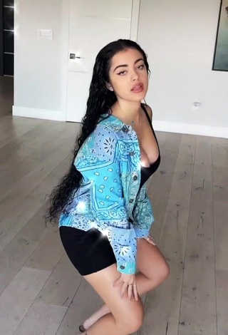 Erotic Malu Trevejo Shows Cleavage in Black Overall