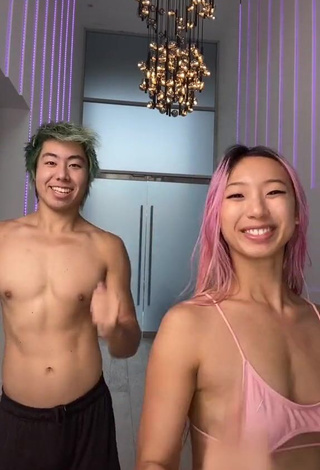 2. Captivating Michelle Chin in Pink Bikini Top (Underboob)