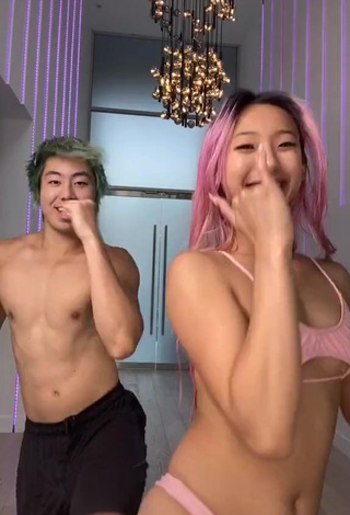 3. Captivating Michelle Chin in Pink Bikini Top (Underboob)