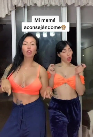 1. Sweetie Natalia Shows Cleavage in Orange Crop Top