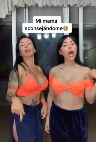 3. Sweetie Natalia Shows Cleavage in Orange Crop Top