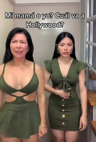 2. Erotic Natalia Shows Cleavage in Olive Dress