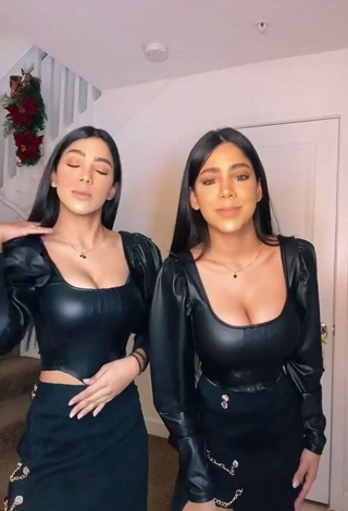 1. Erotic Melanie & Meila Shows Cleavage in Black Bodysuit