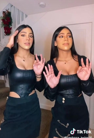 3. Erotic Melanie & Meila Shows Cleavage in Black Bodysuit