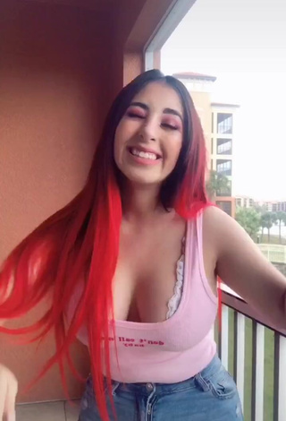 Erotic Ana Daniela Martínez Buenrostro Shows Cleavage in Pink Top on the Balcony